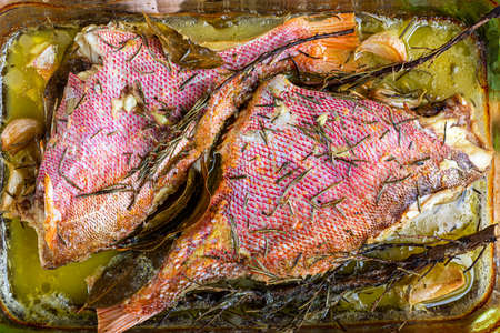 Roasted red fish (known as Olho de CÃ£o in Brazil) seasoned with herbs, garlic, salt and lemon.