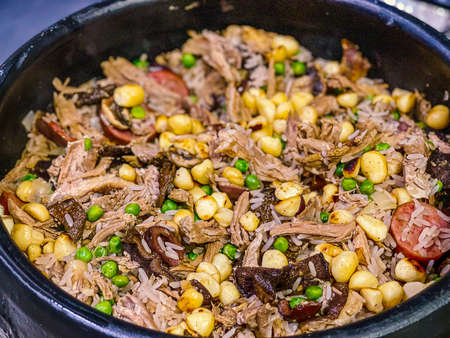 The authentic traditional duck rice from Portugal cooked in red wine, with chickpeas, onions,...