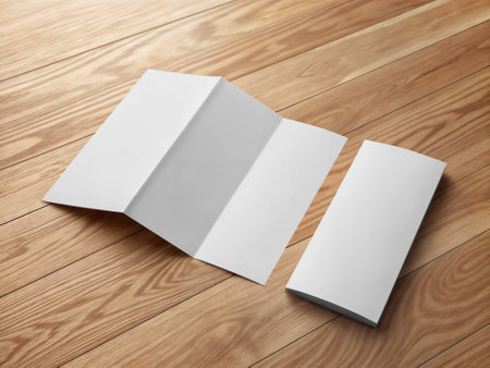 An image of a White Trifold Brochure isolated on a woodの写真素材