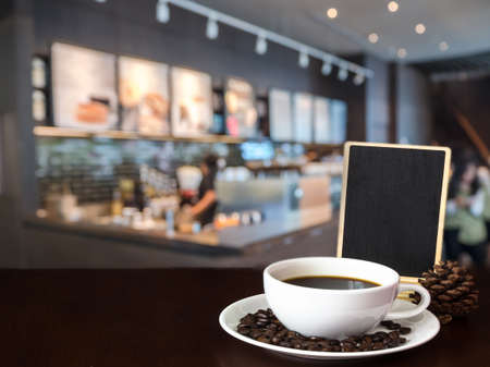 Blank menu board and coffee cup with blurred of coffee shop background