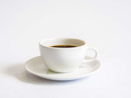 White cup coffee on white backgroundの写真素材