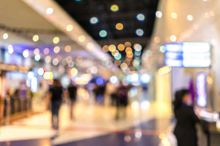 Abstract blurred background image with bokeh light of crowd people at cars exhibition show