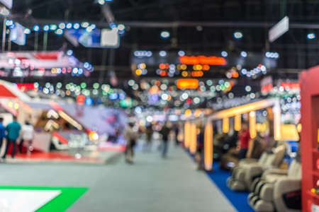 Abstract blurred background image with bokeh light of crowd people at cars exhibition showの写真素材