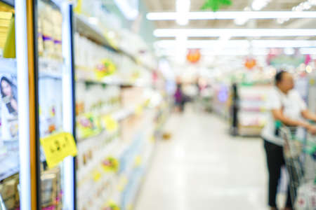 Shopping mall or department store with blurred background and bokeh lightの写真素材