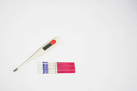 7 days of LH ovulation test strip with thermometerの写真素材