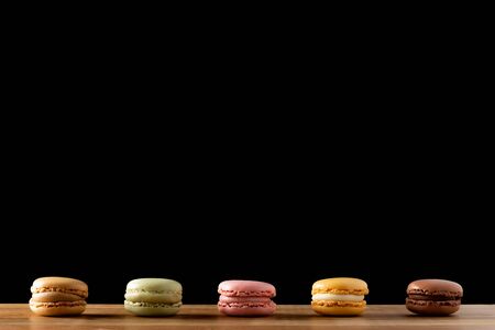 delicious Macarons on dark background with space for textの写真素材