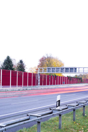 red and yellow light trails on german autobahnの写真素材