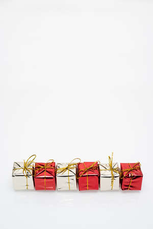 Silver and red christmas gift boxes on white backgroundの写真素材