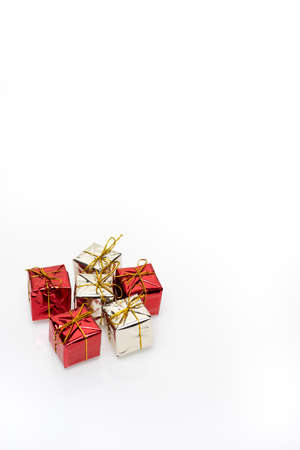 Silver and red christmas gift boxes on white backgroundの写真素材