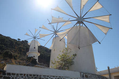 traditional Greek windmilsl against the blue skyの写真素材