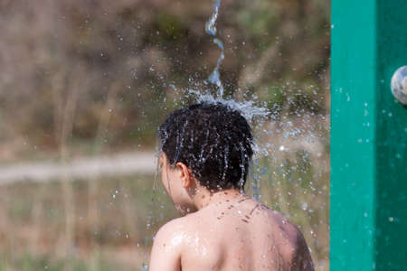 Child in the showerの写真素材