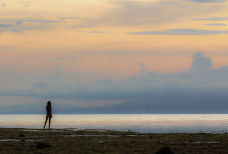 Looking at the sunsetの写真素材