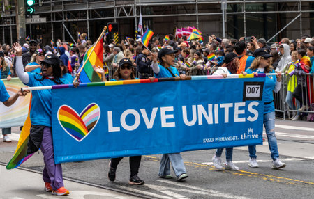 Participants with banner march in the San Francisco Gay Pride Parade.のeditorial素材