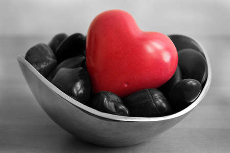 Photograph of a deep red love heart stone finished with selective colouring.の写真素材