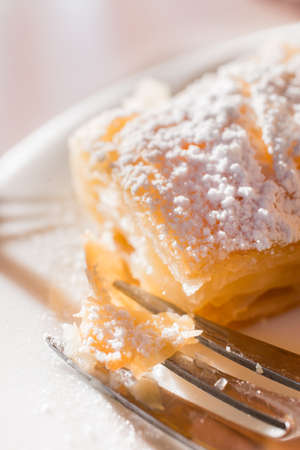 Macro closeup of traditional greek bougatsa, covered in powdered sugar.の写真素材
