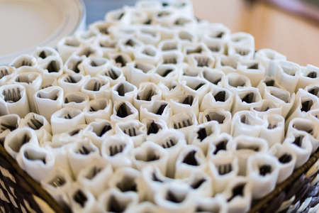 Utensils wrapped in paper napkins.の写真素材