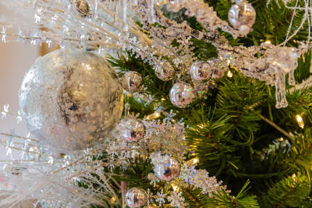 Silver Christmas Ornaments on a Christmas Treeの写真素材