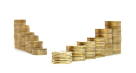 Stacks of coins increasing in height. Isolated on a white background.の写真素材