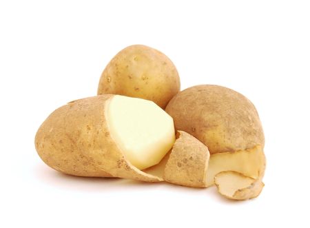 The raw potato on white background.の写真素材