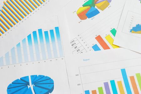 Top view of finance documents with colorful graphs and charts.の写真素材