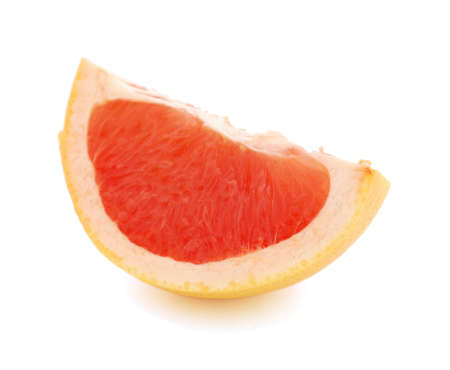 Slice of grapefruit on white background の写真素材
