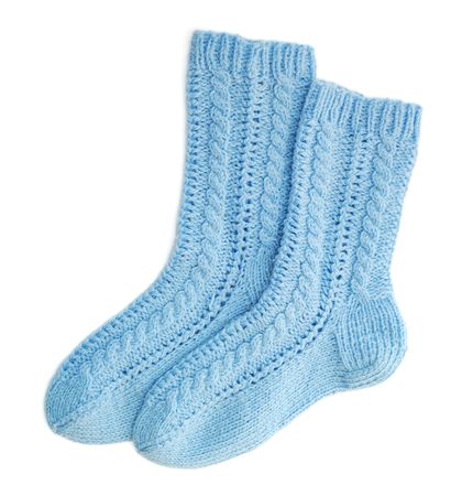 Blue woolen socks on white backgroundの写真素材