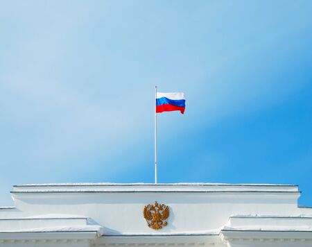 Flag of Russian Federation on the roof of buildingの写真素材