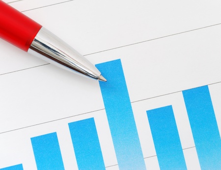 Financial graph and red penの写真素材