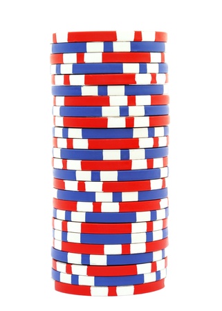 Stack of poker chips isolated on white backgroundの写真素材