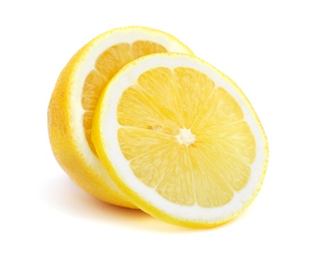 Half of a lemon with one slice isolated on white backgroundの写真素材