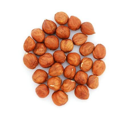 Hazelnuts isolated on white backgroundの写真素材