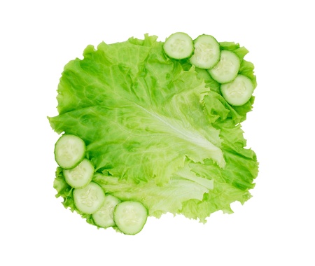 Lettuce leaves with cucumber slices isolated on white backgroundの写真素材