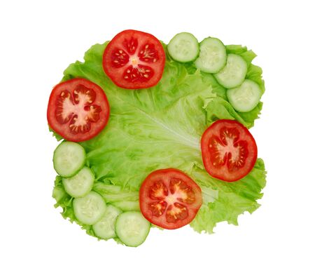 Lettuce with cucumber and tomato slices isolated on white backgroundの写真素材