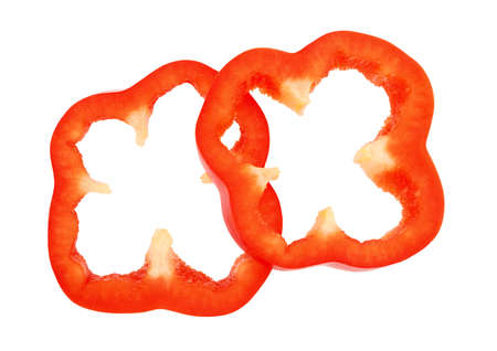 Slices of red bell pepper isolated on white backgroundの写真素材