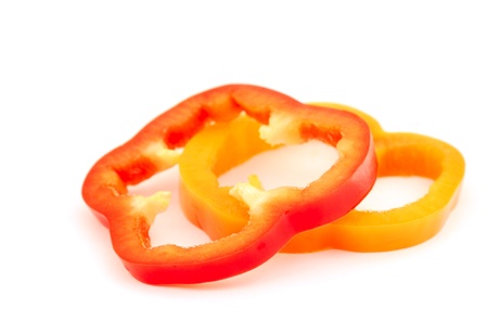 Slices of bell peppers isolated on white backgroundの写真素材