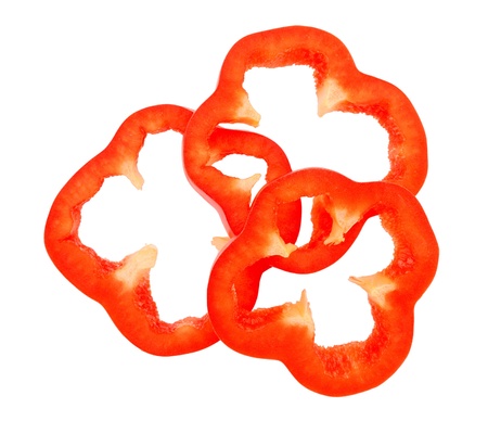Slices of red bell pepper isolated on white backgroundの写真素材