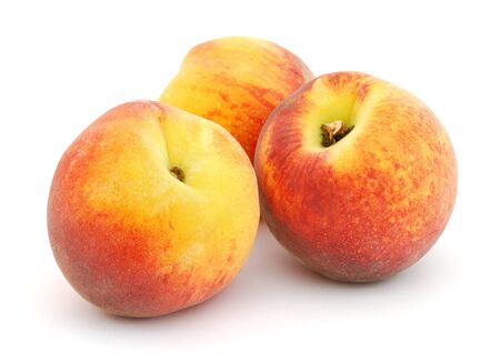 Three peaches isolated on white backgroundの写真素材