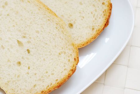 Close-up of bread slices in the plate, top viewの写真素材