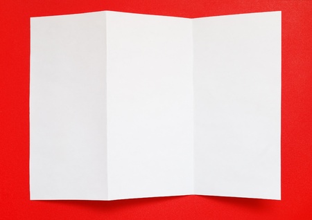 Folded paper on red background, top viewの写真素材