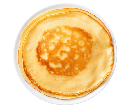 Stack of pancakes on the plate isolated on white background, top viewの素材