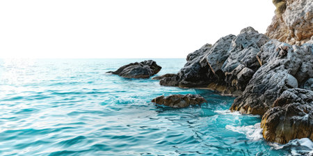 A rocky shoreline with a calm sea isolated on white backgroundの素材