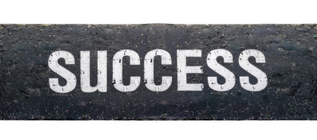 The word "Success" written on the asphalt road, top view, isolated on white backgroundの素材