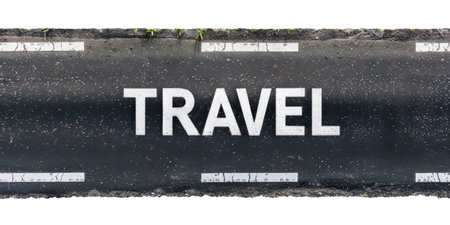 The word "Travel" written on the asphalt road, top view, isolated on white backgroundの素材