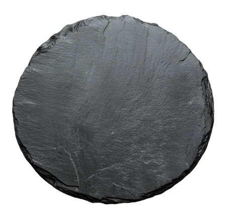Black round slate stone isolated on white background, top viewの素材