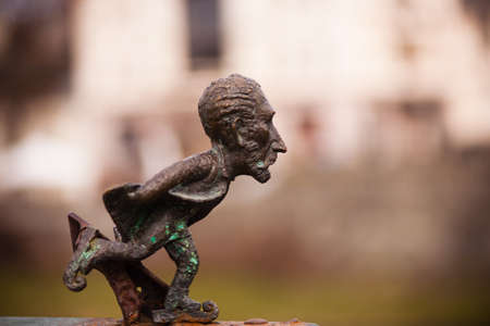 Statue of a man with a bow and arrow in his hand.の写真素材