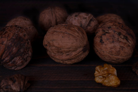 Chopped walnut on a dark background.