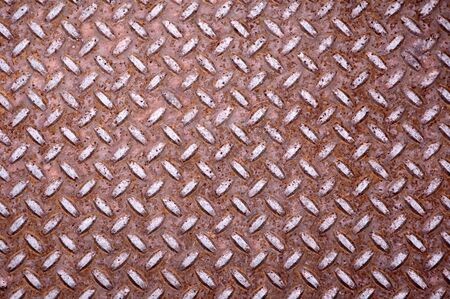 Old rusty steel floor plate. Diamond shaped.