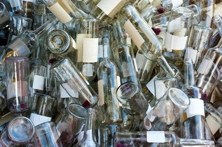 A large heap of empty white wine bottles