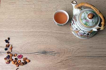 Chinese teapot and tea cup on wooden boardの写真素材