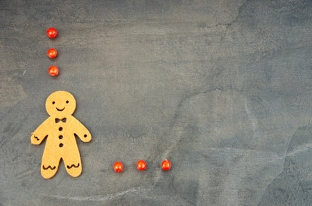 Christmas rustic background with berries and Gingerbread manの写真素材